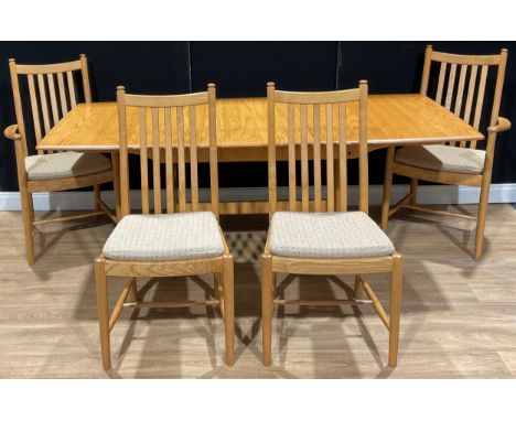 An Ercol extending table, 72.5cm high, 152cm opening to 202.5cm long, 92cm wide; a set of four Ercol Penn dining chairs, comp