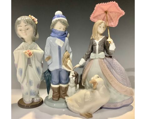 A Lladro figure, Angela, Parasol Girl, 5211; two others, Boy With Puppy and Bearing Flowers, 6151; a Nao goose (4) 
