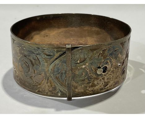 An Edwardian silver buckle cuff bangle, by Charles Horner, engraved with a band of foliate scrolls, monogrammed, marked sterl