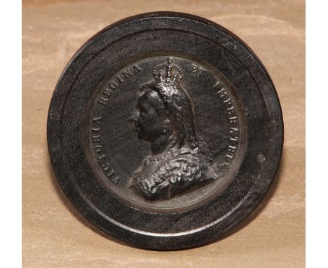 A Victorian bois durci royal commemorative roundel, in relief with a portrait bust of Queen Victoria, 8.5cm diam, c.1887 