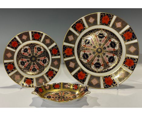 A Royal Crown Derby 1128 Imari pattern dessert plate; a Royal Crown Derby 1128 Imari pattern side plate; a pin dish; all firs