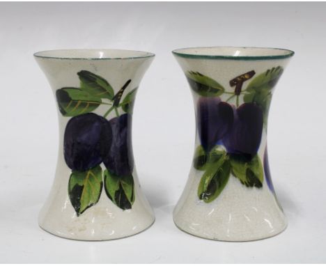 Wemyss ware, a pair of handpainted plums pattern vases of waisted form, painted marks (2) 8 x 11cm. 