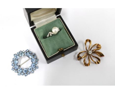 18ct white gold pearl and diamond ring, stamped 750, together with two paste set costume jewellery brooches (3) 