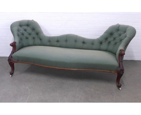 Late 19th century double humpback sofa / settee with button back upholstery and carved mahogany frame, on ceramic castors, 22