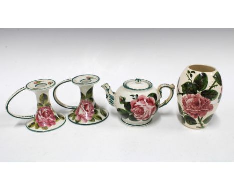 Wemyss ware handpainted cabbage rose pottery to include a pair of chamber candlesticks and small teapot (cover restored) and 