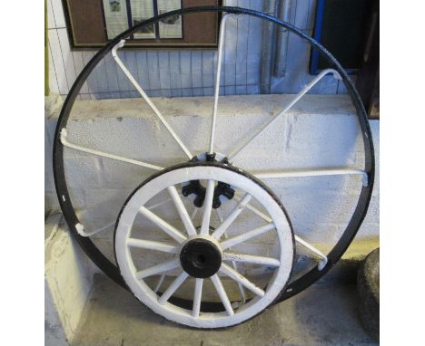 Two vintage cast iron and wooden wagon wheels, one marked 'Bamford Uttoxeter'. (2)(B.P. 21% + VAT) 