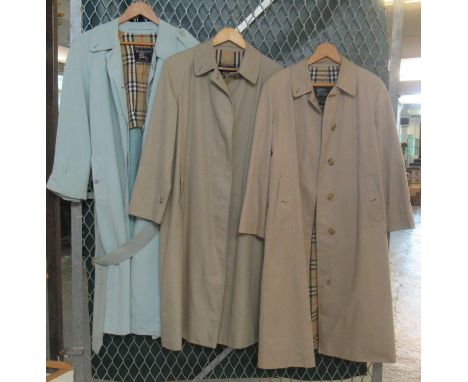 Three vintage ladies macs/raincoats, two beige, one powder blue, all have Burberrys labels, one for Harrods but authenticity 