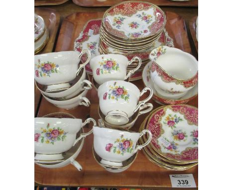 A tray of Paragon 'Honiton' fine bone china teaware, swag decorated in rose pink with floral sprays to include: six coffee cu