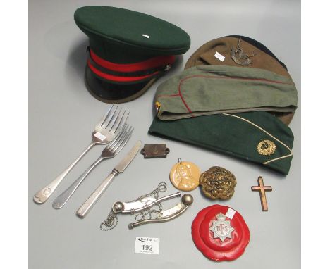 Box of militaria to include; assorted berets, a dress cap, National Fire Service plaque, bosun's whistles, RAF serving fork a