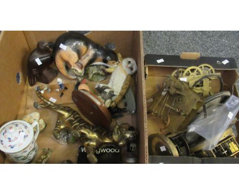 Two boxes, one containing clock movements, the other various ornaments including: a brass tiger, a Leonardo ceramic barn owl 