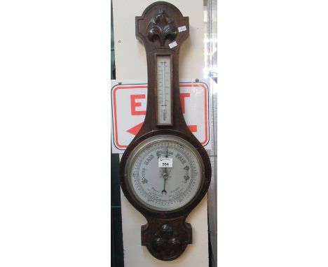 Carved oak wall barometer. (B.P. 21% + VAT) 