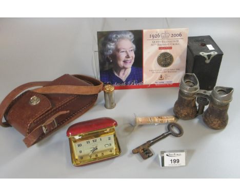Box of oddments to include Queen Elizabeth II 80th birthday crown, vintage Kodak camera, pair of binoculars, travelling alarm