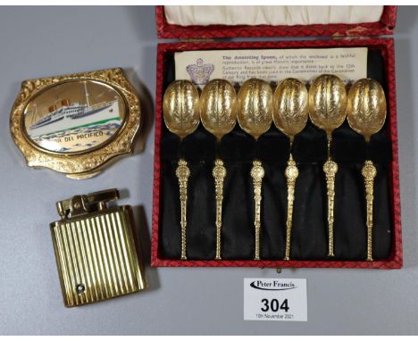 Cased set of gilded anointing spoons, a Stratton powder compact with ship motif and a brass cigarette lighter. (3)(B.P. 21% +