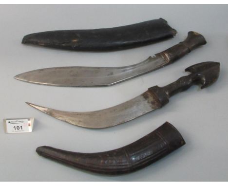 Nepalese Kukri with wooden grip and leather scabbard, together with a Middle Eastern Jambiya type dagger with wooden moulded 