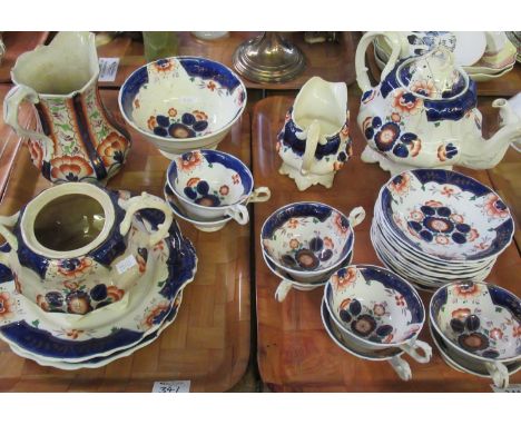 Two trays of 19th Century Gaudy Welsh 'Pinwheel' pattern china to include: eight teacups with eleven saucers, two sandwich pl