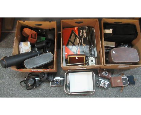 Three boxes of assorted camera equipment to include; various cameras: Cosina, Yashica, Praktica, Conway camera, Kodak, Ferran