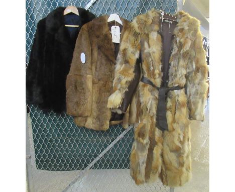 A multi-colour vintage fox fur belted coat with leather trim, a black fur jacket and a rabbit fur jacket. (3)(B.P. 21% + VAT)