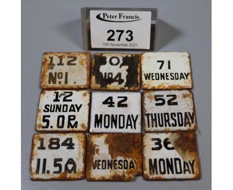 Plated circular box and cover containing an assortment of vintage enamel date and time tablets giving collection times for po