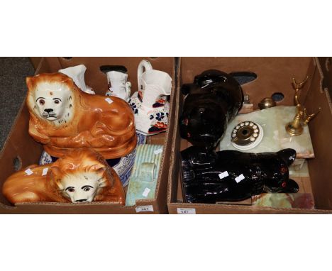 Two boxes containing an assortment of items including: two, probably 19th Century, Staffordshire fireside lions, three gradua