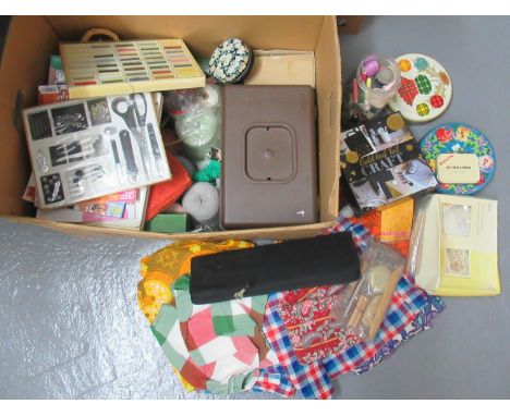 Large box of assorted haberdashery, craft items and textiles to include; yarn, needles, cotton reels, offcuts of printed vint