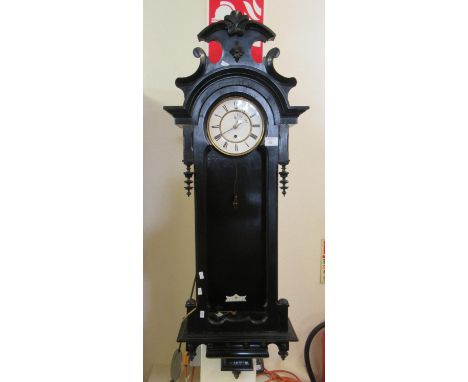 Early 20th Century ebonised finish single train Vienna type wall clock, missing its glass pane, with weight, pendulum and key