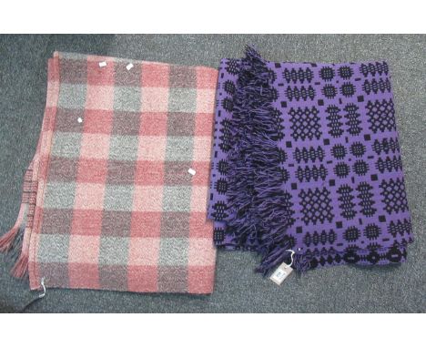 Two vintage woollen blankets, one a purple ground Welsh tapestry with fringed edges, the other a check blanket. (2) (B.P. 21%