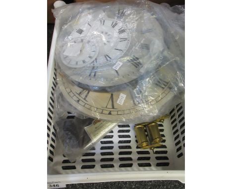 Small box containing clock parts: assorted clock faces, two pendulums, a box of glass carriage clock doors and other pieces o