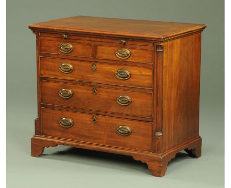 A Georgian mahogany chest of drawers, framed flat top with moulded edge above a brushing slide in turn above two short over t