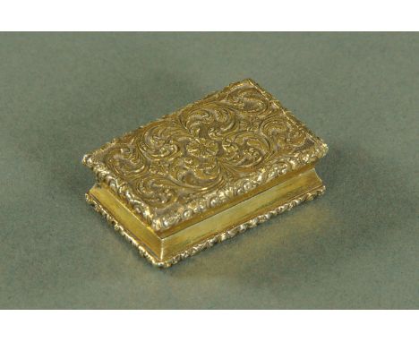 A silver gilt vinaigrette, Nathaniel Mills, Birmingham 1845, book form, with foliate scroll decoration, the underside with en