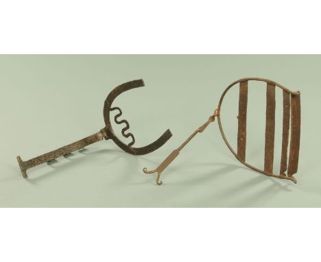 Two 19th century iron trivets, largest 40 cm x 40 cm. CONDITION REPORT: The larger of the two trivets is all over rusty.  The