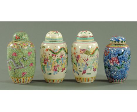 A close pair of Chinese cylindrical vases and domed covers, early 20th century, each decorated with the 100 boys in a dragon 