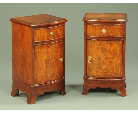 A pair of mahogany bowfronted bedside cabinets, 20th century, with brass ring handles and supported on shaped bracket feet, 4