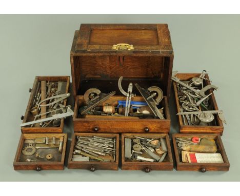 An early 20th century tabletop engineers tool chest, containing a variety of tools to include punches, gauges, micrometers, s