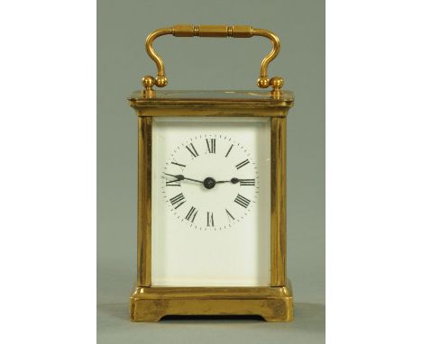 An Edwardian brass cased carriage clock, timepiece only, stamped verso "A.C.C.".  Height excluding carrying handle 10.5 cm. 
