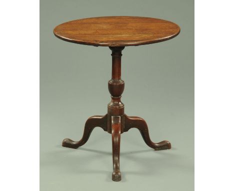 A Georgian mahogany tripod table, with snap action to turned column with three downswept legs terminating in pad feet.  Diame