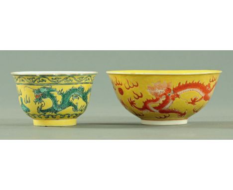 A Chinese dragon bowl, 19th century, the dragons in green and black chasing a pearl amongst clouds between sinuous lotus flow