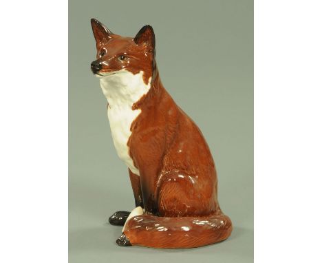 A Beswick fireside fox, model number 2348, in red/brown and white gloss finish.  Height 31.5 cm. CONDITION REPORT: Generally 