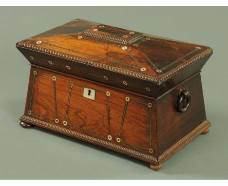 A 19th century rosewood sarcophagus tea caddy, with mother of pearl and white metal stringing, the interior with two caddies 