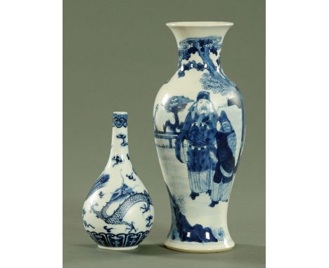 Two Chinese blue and white vases, late 19th century, the taller example painted with figures in a garden surrounding beneath 