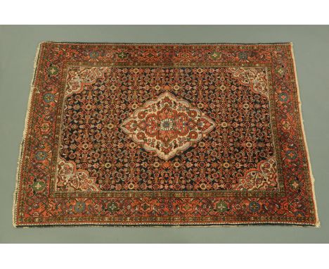 An Eastern rug, with centre rectangular panel with diamond shape motif to middle, with multiple line border, principal colour