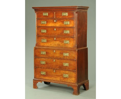 A George III mahogany tallboy, the top half with moulded dentil cornice above two short and three long graduated drawers with
