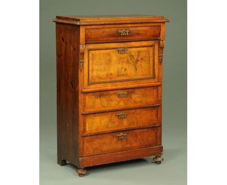 A Victorian mahogany secretaire a abattant, with shallow drawer above a fall front open to a secretaire and the three further