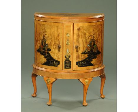 A walnut veneered commode with chinoserie decoration, the well figured top with moulded edge above two panelled cupboard door