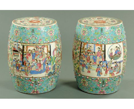 A pair of Chinese porcelain garden seats, circa 1880, each top inset with pierced cash and quatreform panels of females, the 