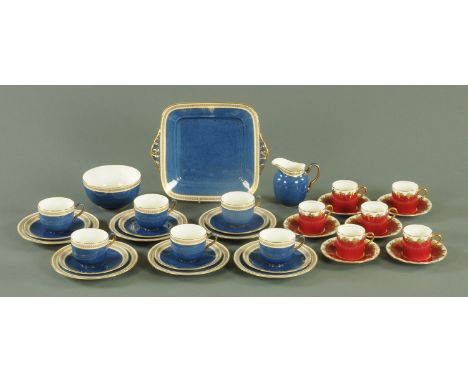 A Wedgwood powder blue six place tea set, with gilt leaf and berry border, Pattern No. 9266, and six Aynsley coffee cans and 