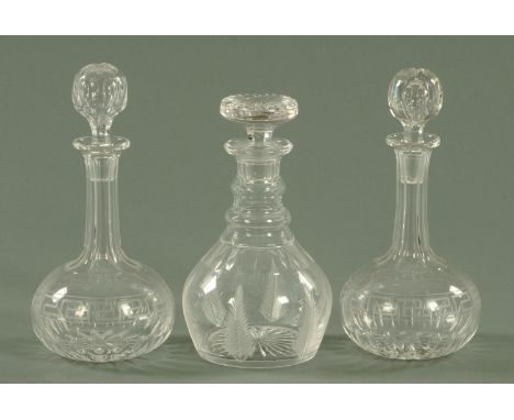 A pair of globe and shaft decanters, late 19th century, with faceted neck above a Greek key band, and a Stuart Crystal Regenc