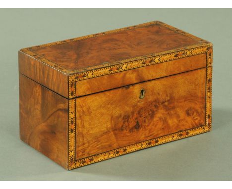 A 19th century walnut tea caddy, with two interior lidded compartments and with marquetry edge, width 23 cm.