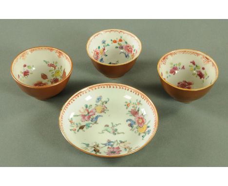 Three Chinese "Batavian" tea bowls and a saucer, 18th century, the interiors decorated with floral sprays and with chocolate 