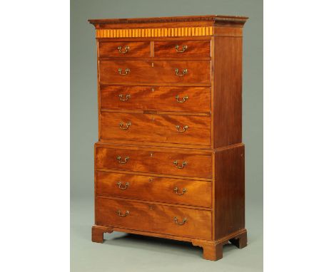A George III mahogany tallboy, with dentil cornice above a satinwood decorated frieze, with two short and three long graduate