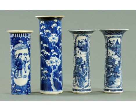 A pair of Chinese blue and white vases, late 19th century, each with a flared rim and decorated with landscaped panels.  Heig